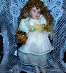 16" BLONDE CURLY HAIR PORCELAIN DOLL WITH BEAR, ON WOODEN CHAIR